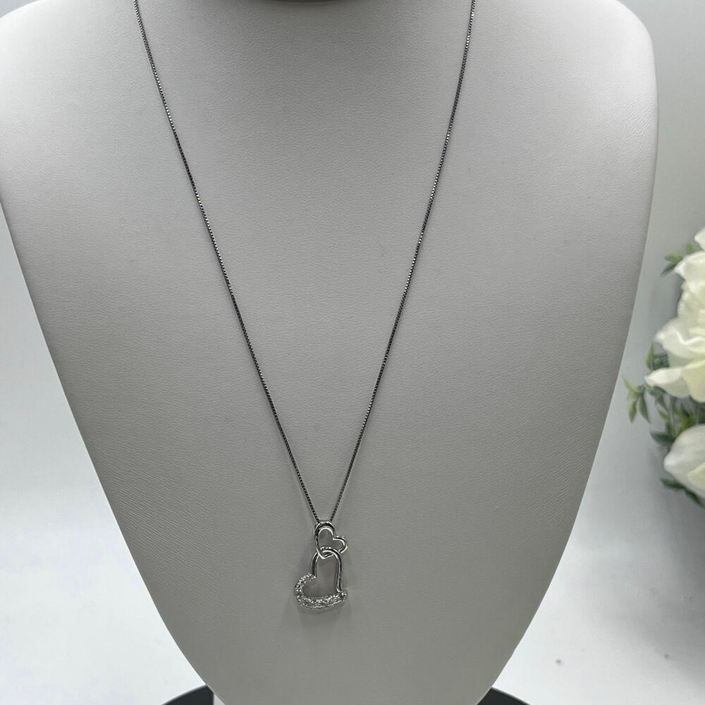 Sterling Silver Diamond Double Heart Pendant Necklace (1/10 ct. t.w.)